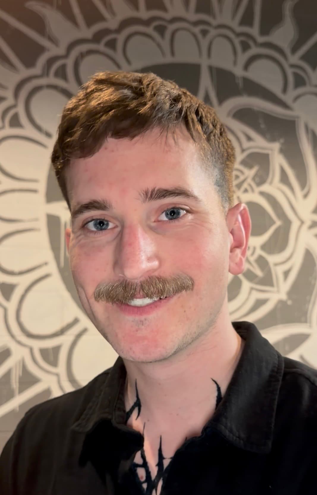 Portrait of Chicago tattoo artist Pete Seyring in the studio.